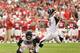 GLENDALE, AZ - OCTOBER 27: Kicker Matt Bryant #3 of the Atlanta Falcons kicks a field goal held by punter Matt Bosher #5 during the NFL game against the Arizona Cardinals at the University of Phoenix Stadium on October 27, 2013 in Glendale, Arizona. The
