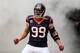 HOUSTON, TX - DECEMBER 01: J.J. Watt #99 of Houston Texans enters the field before the game against the New England Patriots at Reliant Stadium on December 1, 2013 in Houston, Texas. (Photo by Scott Halleran/Getty Images)
