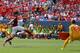 DENVER, CO - JULY 26: Juan Mata #8 of Manchester United scores past Alessio Romangnoli #11 and goalkeeper Lukasz Skorupski #28 of AS Roma during the first half of an International Champions Cup match at Sports Authority Field at Mile High on July 26, 201