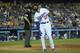 LOS ANGELES, CA - JUNE 14: Matt Kemp #27 of the Los Angeles Dodgers reacts after fouling a pitch off his leg moments before during his at-bat in the eighth inning of the MLB game against the Arizona Diamondbacks at Dodger Stadium on June 14, 2014 in Los
