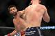 Aug 28, 2013; Indianapolis, IN, USA; Carlos Condit (left) fights Martin Kampmann during UFC Fight NIght 27 at Bankers Life Fieldhouse. Mandatory Credit: Pat Lovell-USA TODAY Sports