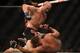 July 26, 2014; San Jose, CA, USA; Kyle Kingsbury (red gloves) is hit by Patrick Cummins (blue gloves) during the light heavyweight bout of the FOX UFC Saturday at SAP Center. Mandatory Credit: Kyle Terada-USA TODAY Sports