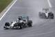 BUDAPEST, HUNGARY - JULY 27: Lewis Hamilton of Great Britain and Mercedes GP and Kevin Magnussen of Denmark and McLaren enter turn one during the Hungarian Formula One Grand Prix at Hungaroring on July 27, 2014 in Budapest, Hungary. (Photo by Mark Thomp