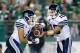 REGINA, SK, CANADA - JULY 26: Ricky Ray #15 hands the ball to Anthony Coombs #1 of the Toronto Argonauts in a game between the Toronto Argonauts and Saskatchewan Roughriders in week 5 of the 2014 CFL season at Mosaic Stadium on July 26, 2014 in Regina, Sa