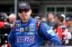 INDIANAPOLIS, IN - JULY 26: Kyle Busch, driver of the #18 Snickers Toyota, looks on from the grid during qualifying for the NASCAR Sprint Cup Series Crown Royal Presents The John Wayne Walding 400 at the Brickyard Indianapolis Motor Speedway on July 26,