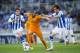SAN SEBASTIAN, SPAIN - APRIL 05: Karim Benzema of Real Madrid CF duels for the ball with Mikel Gonzales of Real Sociedad during the La Liga match between Real Sociedad and Real Madrid CF at Estadio Anoeta on April 5, 2014 in San Sebastian, Spain. (Phot
