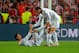 LISBON, PORTUGAL - MAY 24: Gareth Bale of Real Madrid helps Cristiano Ronaldo of Real Madrid to his feet during the UEFA Champions League Final between Real Madrid and Atletico de Madrid at Estadio da Luz on May 24, 2014 in Lisbon, Portugal. (Photo by Mi