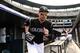 Jul 12, 2014; Denver, CO, USA; Colorado Rockies left fielder Carlos Gonzalez (5) takes to the field before the start of the game against the Minnesota Twins at Coors Field. The Twins defeated the Rockies 9-3. Mandatory Credit: Ron Chenoy-USA TODAY Sports