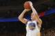 OAKLAND, CA - MAY 1: Klay Thompson #11 of the Golden State Warriors shoots a three pointer against the Los Angeles Clippers in Game Six of the Western Conference Quarterfinals during the 2014 NBA Playoffs at Oracle Arena on May 1, 2014 in Oakland, Califor