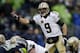 SEATTLE, WA - JANUARY 11: Quarterback Drew Brees #9 of the New Orleans Saints calls out from under center in the first half against the Seattle Seahawks during the NFC Divisional Playoff Game at CenturyLink Field on January 11, 2014 in Seattle, Washingto