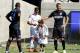 BERKELEY, CA - JULY 26: Lucas Vazquez of Real Madrid signs an autograph for a young fan who ran onto the field while Nemanja Vidic #15 of FC Internazionale rubs his head during their game in the International Champions Cup 2014 at California Memorial St