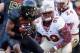 COLLEGE PARK, MD - NOVEMBER 17: Defensive tackle Nile Lawrence-Stample #99 of the Florida State Seminoles moves in to tackle wide receiver Stefon Diggs #1 of the Maryland Terrapins during the fourth quarter of the Seminoles 41-14 win at Byrd Stadium on No