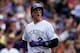 DENVER, CO - MAY 18: Troy Tulowitzki #2 of the Colorado Rockies celebrates after scoring on a single by Carlos Gonzalez (not pictured) during the seventh inning against the San Diego Padres at Coors Field on May 18, 2014 in Denver, Colorado. The Rockies