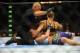 Rousey (top) punched her opponent into unconsciousness at UFC 175