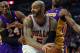 CHICAGO, IL - JANUARY 21: Carlos Boozer #5 of the Chicago Bulls looks to pass under pressure from Kobe Bryant #24 and Metta World Peace #15 of the Los Angeles Lakers at the United Center on January 21, 2013 in Chicago, Illinois. The Bulls defeated the Lak