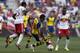 HARRISON, NJ - JULY 26: Santi Cazorla #19 of Arsenal \moves the ball in front of Chris Duvall #25 of New York Red Bulls during their friendly match at Red Bull Arena on July 26, 2014 in Harrison, NJ. (Photo by Jeff Zelevansky/Getty Images)