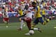 HARRISON, NJ - JULY 26: Santi Cazorla #19 of Arsenal fights for the ball with Chris Duvall #25 of New York Red Bulls during their friendly match at Red Bull Arena on July 26, 2014 in Harrison, NJ. (Photo by Jeff Zelevansky/Getty Images)