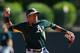 GLENDALE, AZ - MARCH 10: Infielder Addison Russell #17 of the Oakland Athletics warms up during the spring training game against the Los Angeles Dodgers at Camelback Ranch on March 10, 2014 in Glendale, Arizona. (Photo by Christian Petersen/Getty Images