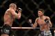 Mar 16, 2013; Montreal, Quebec, CAN; Nick Diaz (blue) taunts Georges St.Pierre (red) during their Welterweight title bout at UFC 158 at the Bell Centre. Mandatory Credit: Eric Bolte-USA TODAY Sports