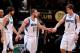 MINNEAPOLIS, MN - MARCH 12: J.J. Barea #11 of the Minnesota Timberwolves celebrates with teammates Alexey Shved #1 and Ricky Rubio #9 during a game against the San Antonio Spurs on March 12, 2013 at Target Center in Minneapolis, Minnesota. NOTE TO USER: U
