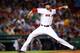 BOSTON, MA - JULY 08: Andrew Miller #30 of the Boston Red Sox pitches against the Chicago White Sox during the game at Fenway Park on July 8, 2014 in Boston, Massachusetts. (Photo by Jared Wickerham/Getty Images)