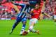 LONDON, ENGLAND - APRIL 12: Marc-Antoine Fortune of Wigan Athletic is tackled by Thomas Vermaelen of Arsenal during the FA Cup Semi-Final match between Wigan Athletic and Arsenal at Wembley Stadium on April 12, 2014 in London, England. (Photo by Mike He