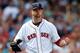 BOSTON, MA - JULY 20: Jon Lester #31 of the Boston Red Sox reacts after getting out of trouble in the sixth inning against the Kansas City Royals at Fenway Park on July 20, 2014 in Boston, Massachusetts. (Photo by Jim Rogash/Getty Images)