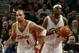 CLEVELAND - MARCH 6: LeBron James #23 and Carlos Boozer #1 of the Cleveland Cavaliers against the Milwaukee Bucks at Gund Arena on March 6, 2004 in Cleveland, Ohio. NOTE TO USER: User expressly acknowledges and agrees that, by downloading and or using t