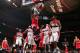 Forward Taj Gibson dunks amid a crowd of Washington Wizards players.