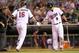 Jul 21, 2014; Minneapolis, MN, USA; Minnesota Twins left fielder Josh Willingham (16) celebrates with catcher Kurt Suzuki (8) after hitting a home run in the eighth inning against the Cleveland Indians at Target Field. The Twins won 4-3. Mandatory Credit: