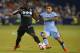 KANSAS CITY, KS - JULY 23: Jimmy Medranda #94 of SportingKC deflects the ball away from Jesus Navas #15 of Manchester City midway in the second half on July 23rd at Sporting Park in Kansas City, Kansas. (Photo by Kyle Rivas/Getty Images)