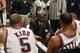 EAST RUTHERFORD, NJ - FEBRUARY 3: Jason Kidd #5 and Kerry Kittles #30 of the New Jersey Nets listen to instructions given by head coach Byron Scott during the NBA game against the Seattle Sonics at Continental Airlines Arena on February 3, 2003 in East R