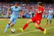 NEW YORK, NY - JULY 30: Edin Dzeko #10 of Manchester City and Sebastian Coates #16 of Liverpool vie for the ball during the International Champions Cup 2014 at Yankee Stadium on July 30, 2014 in the Bronx borough of New York City. (Photo by Mike Stobe/G