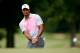 AKRON, OH - JULY 31: Tiger Woods chips onto the fourth green during the first round of the World Golf Championships-Bridgestone Invitational at Firestone Country Club South Course on July 31, 2014 in Akron, Ohio. (Photo by Gregory Shamus/Getty Images)