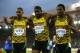 GLASGOW, SCOTLAND - JULY 31: (L-R) Silver medalist Warren Weir of Jamaica, Bronze medalist Jason Livermore of Jamaica and Gold medalist Rasheed Dwyer of Jamaica celebrate after the Men's 200 metres Final at Hampden Park during day eight of the Glasgow 2