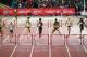 GLASGOW, SCOTLAND - JULY 31: Kaliese Spencer of Jamaica (3R) clears the final hurdle ahead of Eilidh Child of Scotland (2L) in the Women's 400 metres hurdles final at Hampden Park during day eight of the Glasgow 2014 Commonwealth Games on July 31, 2014 i