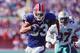 9 OCT 1994: BUFFALO BILLS WIDE RECEIVER ANDRE REED ON A RUN AS MIAMI DOLPHINS DEFENDER J.B. BROWN #37 PURSUES DURING THE BILLS 21-11 WIN AT RICH STADIUM IN ORCHARD PARK, NEW YORK. Mandatory Credit: Rick Stewart/ALLSPORT