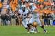 Nov 9, 2013; Knoxville, TN, USA; Auburn Tigers offensive linesman Alex Kozan (63) gets set to block for Auburn quarterback Nick Marshall (14) as he rushes away from Tennessee Volunteers defensive back JaRon Toney (35) during the second half at Neyland Sta