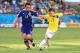 CUIABA, BRAZIL - JUNE 24: Juan Fernando Quintero of Colombia holds off Toshihiro Aoyama of Japan during the 2014 FIFA World Cup Brazil Group C match between Japan and Colombia at Arena Pantanal on June 24, 2014 in Cuiaba, Brazil. (Photo by Elsa/Getty Im
