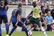 PITTSBURGH, PA - JULY 27: Mario Balotelli #45 of AC Milan handles the ball against Jack Rodwell #17 of Manchester City during International Champions Cup 2014 at Heinz Field on July 27, 2014 in Pittsburgh, Pennsylvania. (Photo by Justin K. Aller/Getty I