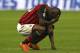 MILAN, ITALY - APRIL 13: Mario Balotelli of AC Milan appears dejected during the Serie A match between AC Milan and Calcio Catania at San Siro Stadium on April 13, 2014 in Milan, Italy. (Photo by Marco Luzzani/Getty Images)