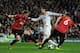 MADRID, SPAIN - FEBRUARY 13: Cristiano Ronaldo of Real Madrid is put under pressure by Jonny Evans and Phil Jones of Manchester United during the UEFA Champions League Round of 16 first leg match between Real Madrid and Manchester United at Estadio Sant