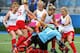 GLASGOW, SCOTLAND - AUGUST 01: Goalkeeper Maddie Hinch of England is mobbed by her teammates as she saves the deciding penalty shuttle to put England through to the Gold Medal final during the Women's Hockey Semi Final between New Zealand and England at