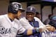ST. PETERSBURG, FL - JUNE 6: Manager Lloyd McClendon #23 of the Seattle Mariners speaks with Robinson Cano #22 of the Seattle Mariners in the dugout during the third inning of a game against the Tampa Bay Rays on June 6, 2014 at Tropicana Field in St. Pe