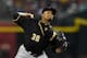 PHOENIX, AZ - AUGUST 01: Edinson Volquez #36 of the Pittsburgh Pirates delivers a first inning pitch against the Arizona Diamondbacks at Chase Field on August 1, 2014 in Phoenix, Arizona. (Photo by Norm Hall/Getty Images)