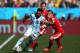 SAO PAULO, BRAZIL - JULY 01: Ezequiel Lavezzi of Argentina is challenged by Xherdan Shaqiri of Switzerland during the 2014 FIFA World Cup Brazil Round of 16 match between Argentina and Switzerland at Arena de Sao Paulo on July 1, 2014 in Sao Paulo, Brazil