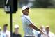 Jul 31, 2014; Akron, OH, USA; Tiger Woods reacts to his tee shot on the seventh hole during the first round of the WGC-Bridgestone Invitational golf tournament at Firestone Country Club - South Course. Mandatory Credit: Joe Maiorana-USA TODAY Sports