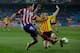 MADRID, SPAIN - DECEMBER 18: Javier Manquillo (L) of Atletico de Madrid competes for the ball with Alberto Rodriguez Carroza (R) during the Copa del Rey Round of 32 second leg match between Club Atletico de Madrid and Sant Andreu at Vivente Calderon Stadi