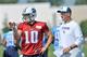 Jul 26, 2014; Nashville, TN, USA; Tennessee Titans quarterback Jake Locker (10) talks with head coach Ken Whisenhunt during training camp at Saint Thomas Sports Park. Mandatory Credit: Jim Brown-USA TODAY Sports
