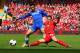 LIVERPOOL, ENGLAND - APRIL 27: Mohamed Salah of Chelsea is tackled by Jon Flanagan of Liverpool during the Barclays Premier League match between Liverpool and Chelsea at Anfield on April 27, 2014 in Liverpool, England. (Photo by Clive Brunskill/Getty Im